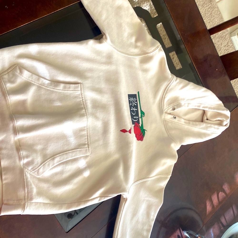 Cream color sweatshirt with rose. Size small.